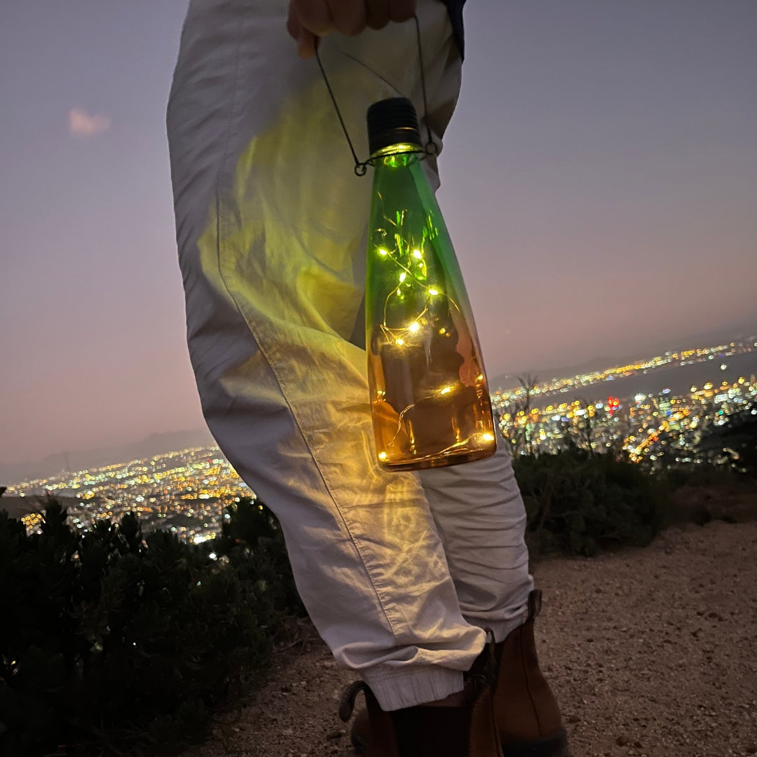 Lámpara de energía solar Luz LED en botella de vidrio con soporte Luz de reducción de carga